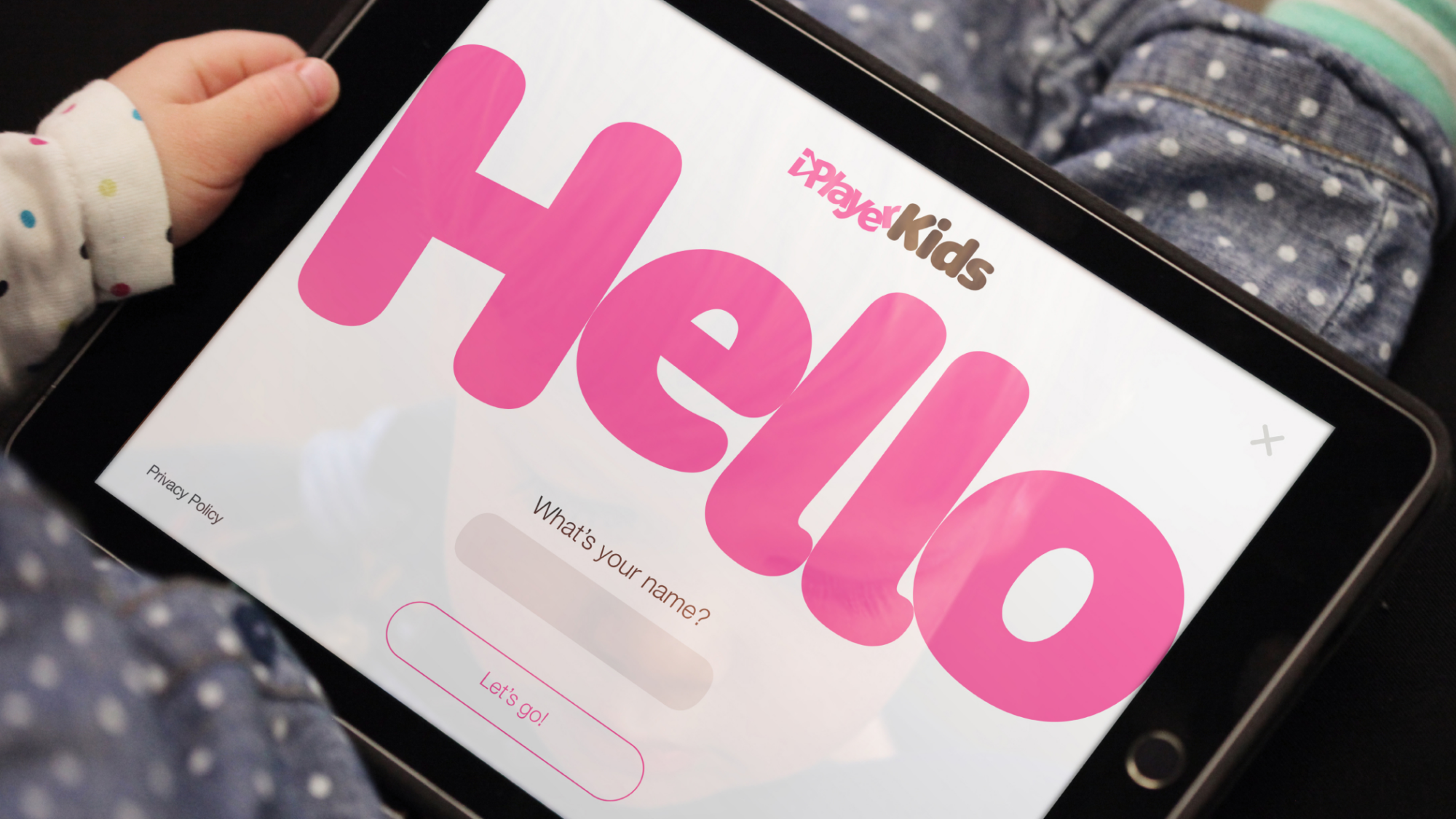 A tablet device showing the iPlayer Kids brand in action. The word 