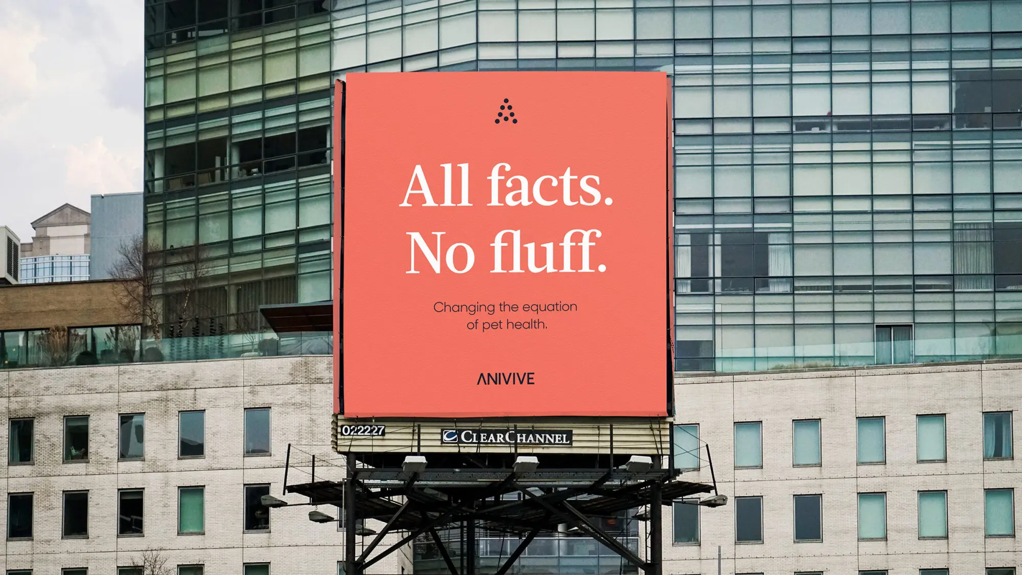 A large red billboard on a building that says: 'All facts. No fluff.