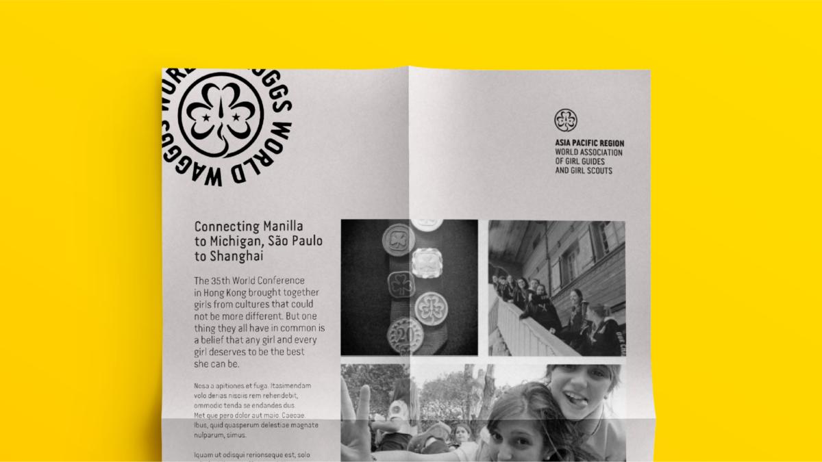 A black and white WAGGGS brochure on a yellow background.